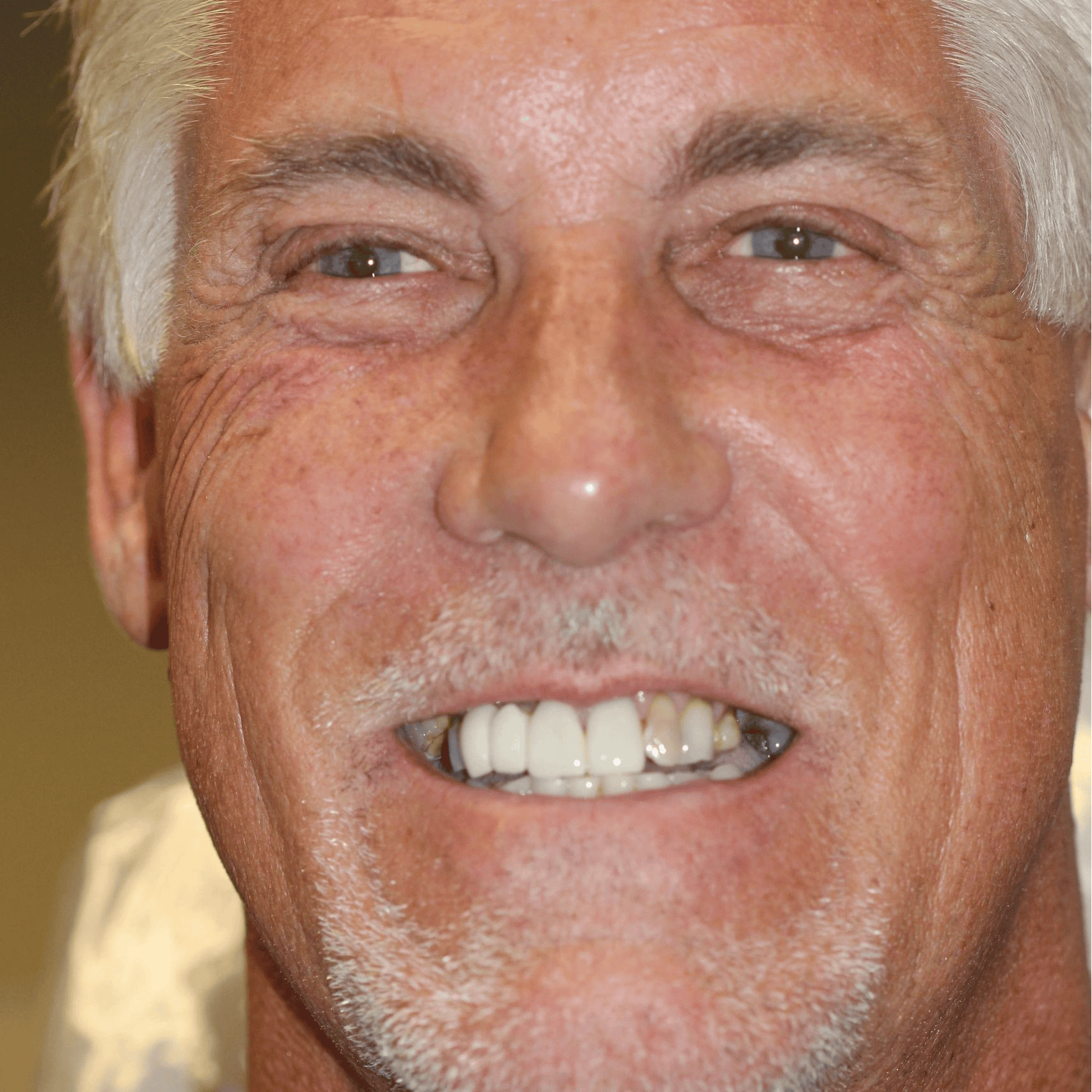 Close-up of a man smiling warmly