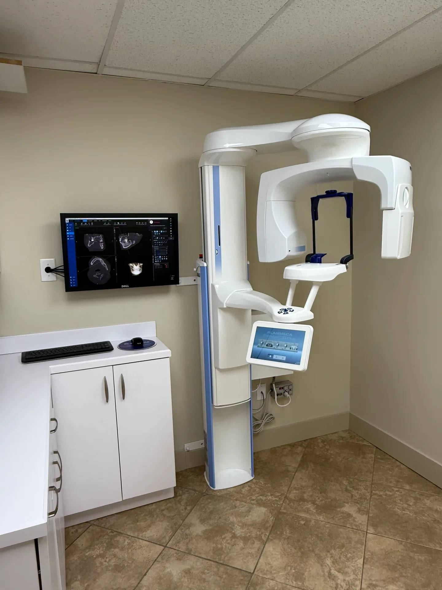 Modern dental imaging equipment in room