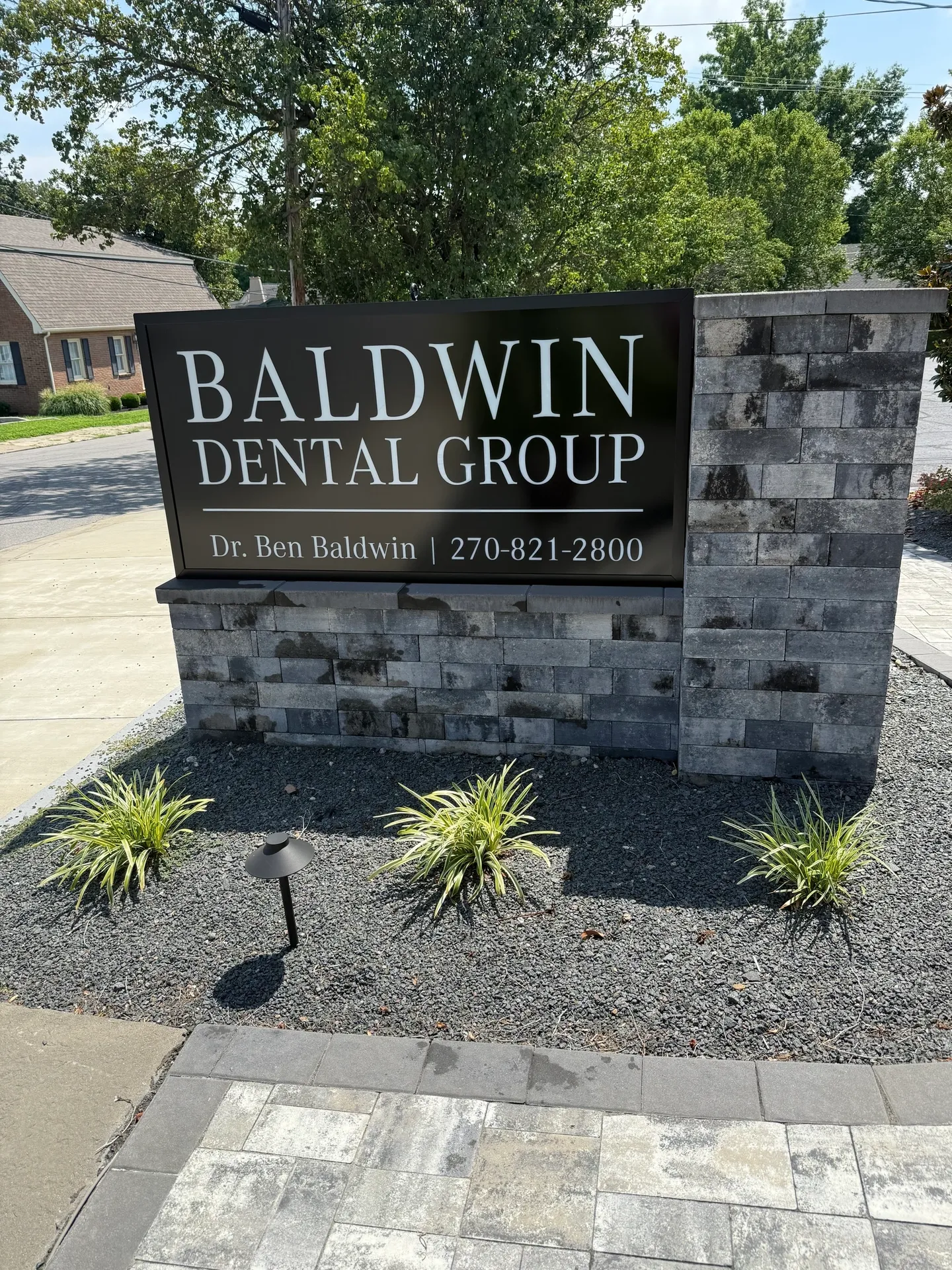 Dental office sign with contact details