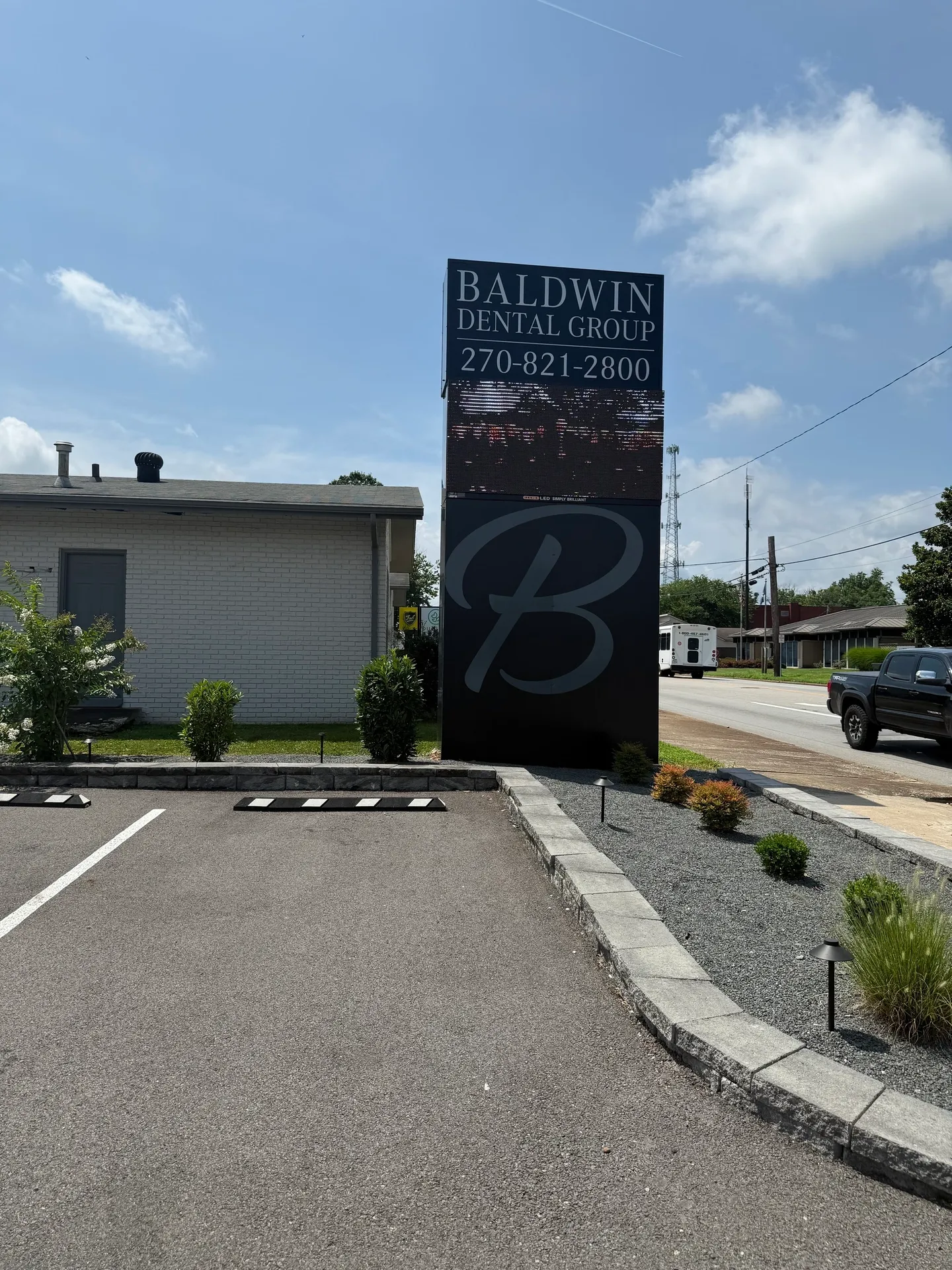 Dental office sign under blue sky