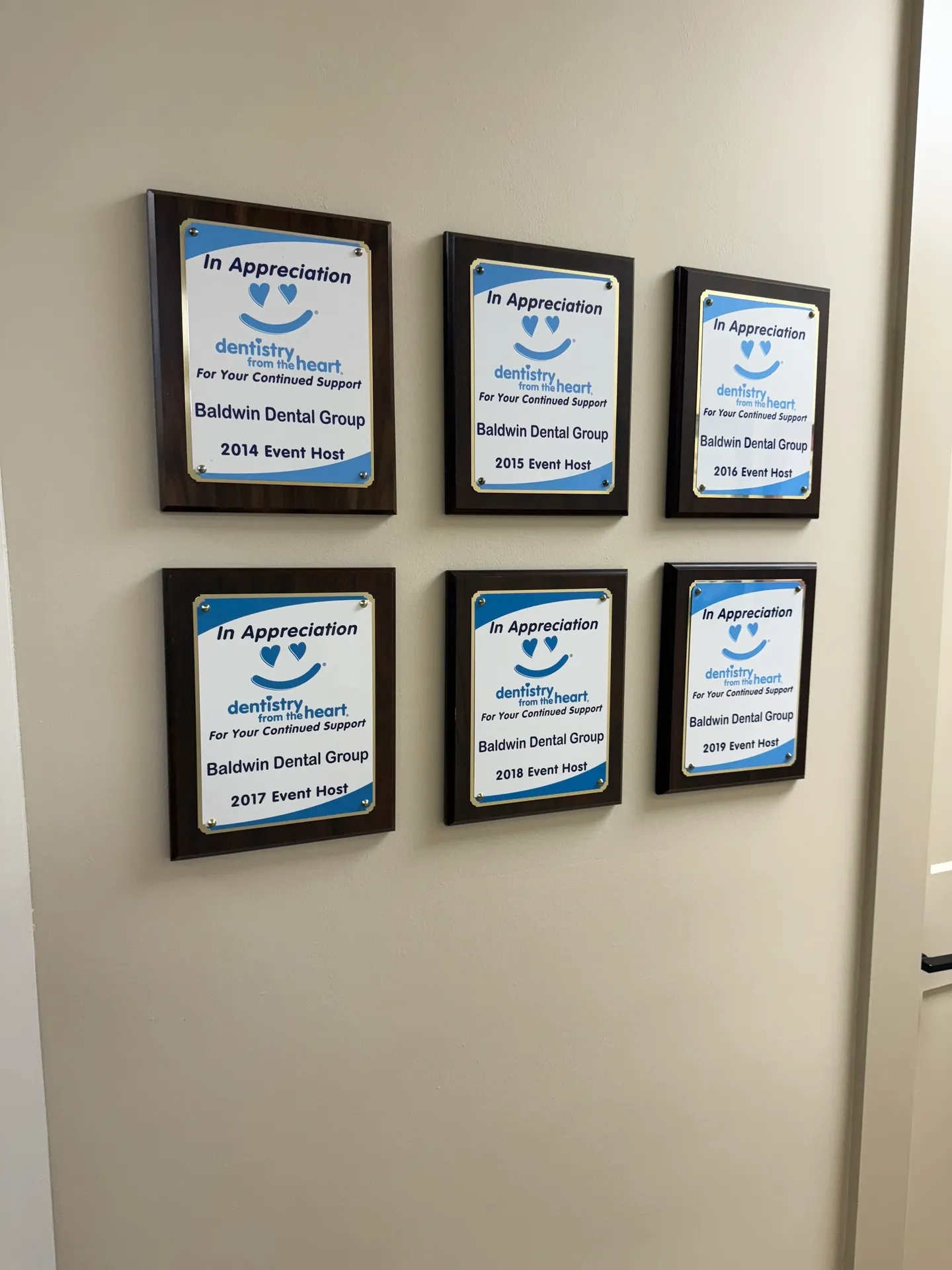 Award plaques on office wall